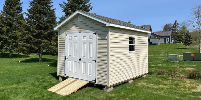 Shed in backyard with ramp