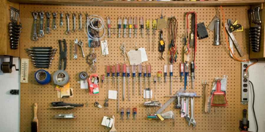 Pegboard with work tools on the board