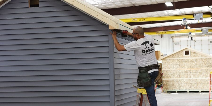 Blog_DakotaEmployeeAssemblingShed_900x450