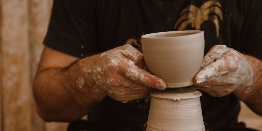 Blog_ManThrowingPottery_900x450