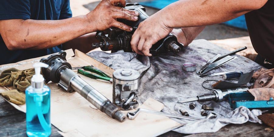 Blog_RepairingCarPartsOnWorkbench_900x450