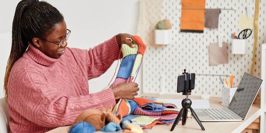 Blog_Woman Crocheting in Her Craft Shed_900x450