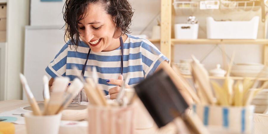 Blog_Woman Working in a Craft Shed_900x450