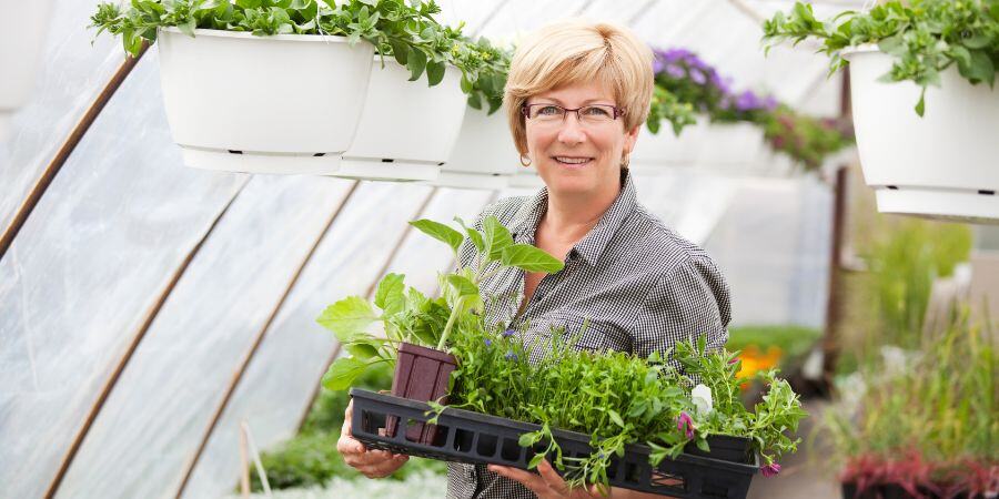 Blog_Woman in Greenhouse_900x450