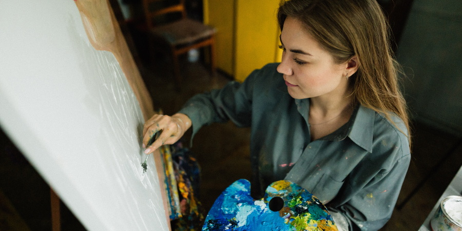 Artist painting on a canvas.