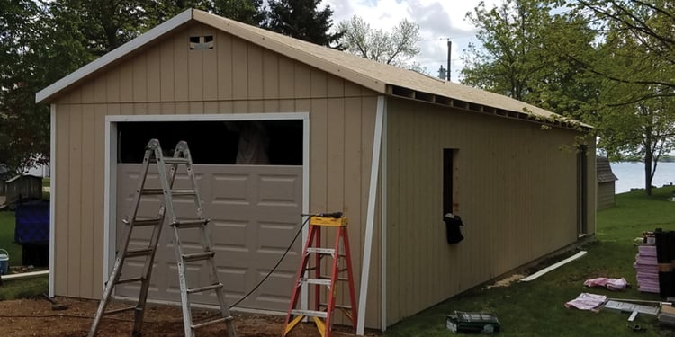 Phase 3 of on-site construction—Clopay Premium Series overhead garage door in place