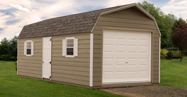 Dakota Storage's High Barn style garage package has shingles, vinyl siding, and an overhead garage door