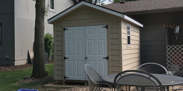 The finished product! Small backyard Ranch shed with double doors, and 2 windows